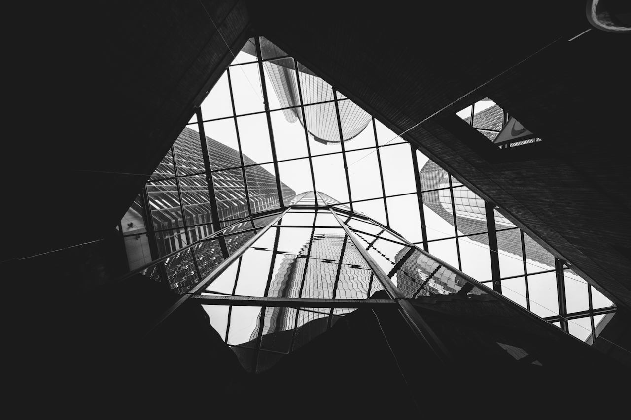 Website homepage for ErgoNext product development featuring navigation links, blurred abstract background, project overview, and objectives text.